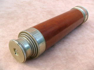 Closed view of telescope showing swivel dust cover in eyepiece
