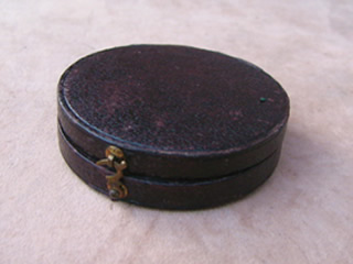Top view of Moroccan leather case with brass clasp