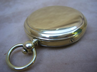 19th century polished brass pocket compass with mother of pearl dial