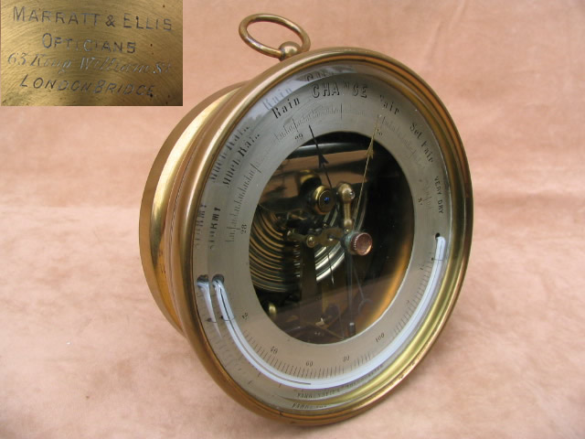 19th century brass aneroid barometer with curved thermometer