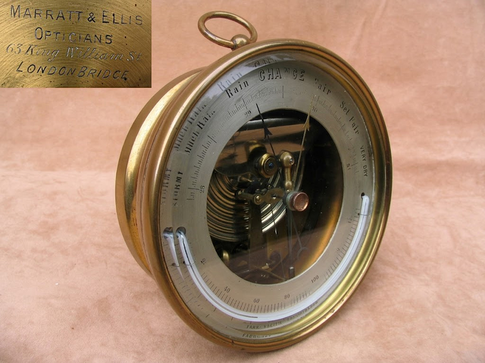 19th century brass aneroid barometer with curved thermometer